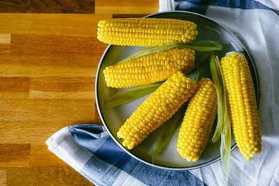 High angle view of boiled corn in bowl on table