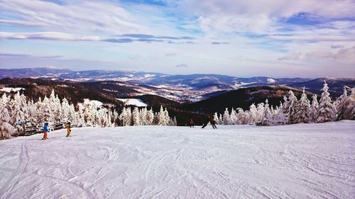 Scenic view of snowcapped mountains against sky