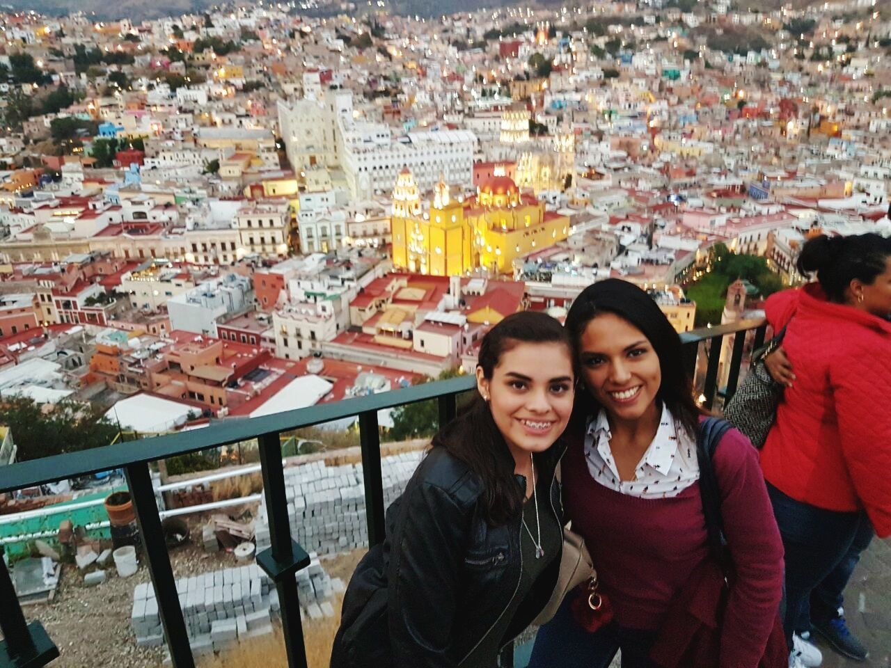 togetherness, lifestyles, women, two people, leisure activity, city, friendship, happiness, smiling, portrait, females, real people, community, adult, outdoors, people, young women, crowd, young adult, cityscape, urban skyline, adults only, day