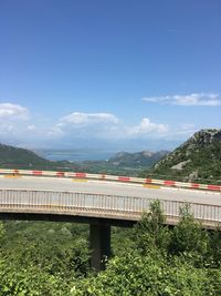 Bridge against landscape and sky