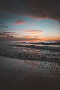 Scenic view of beach against sky during sunset