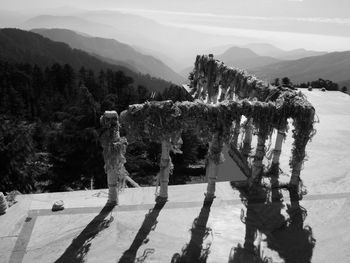 Observation point by mountains against sky