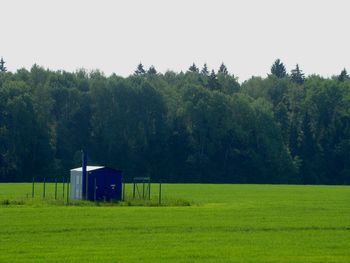 Built structure on field against sky