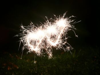 Close-up of firework display at night