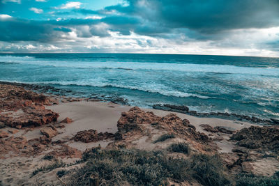 Scenic view of beach against sky