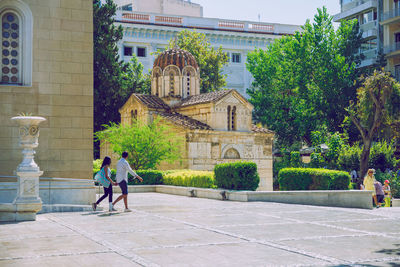 People in front of historic building