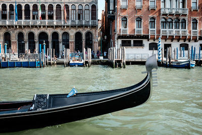 Boats moored in canal