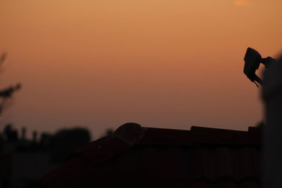 Silhouette of person against sky during sunset