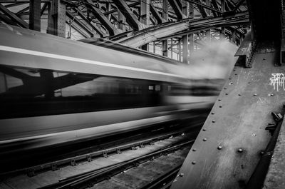 Blurred motion of train at railroad station