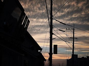 Low angle view of building against cloudy sky