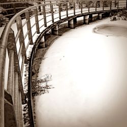 Railroad tracks on snow covered landscape