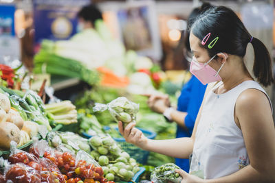 Midsection of woman at market stall