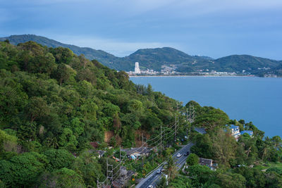 High angle view of trees by sea against sky