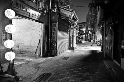 Illuminated city street at night