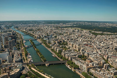 Buildings skyline and river seine seen from the eiffel tower in paris. the famous capital of france.