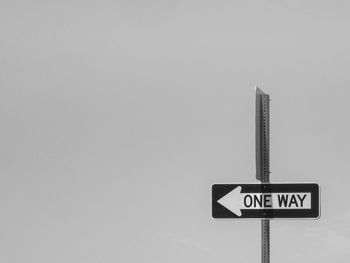 Close-up of road sign against white background