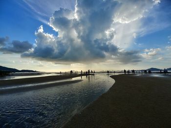 Panoramic view of beach against sky during sunset