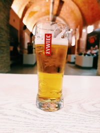 Close-up of beer glass on table