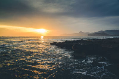 Scenic view of sea against sky during sunset