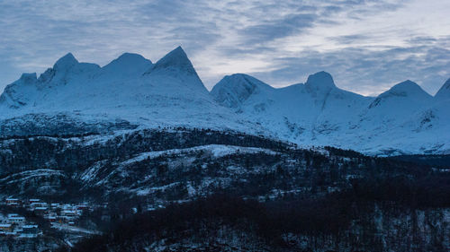 Scenic view of snowcapped mountains against sky