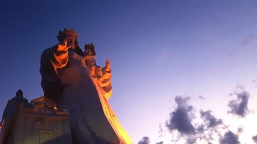 Low angle view of statue against sky