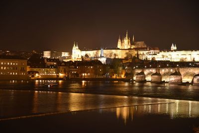 Illuminated city at waterfront