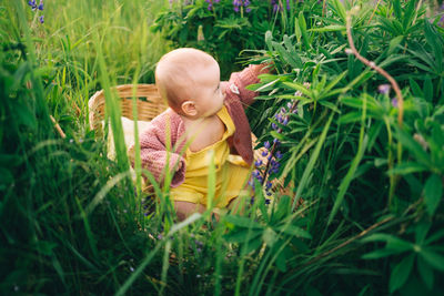 High angle view of woman sitting on grass