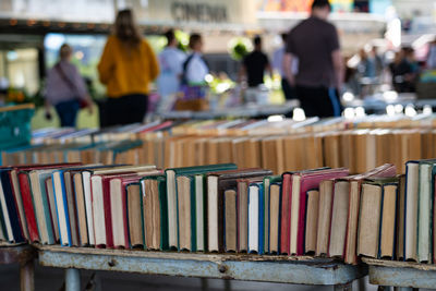 Stack of books in row at market