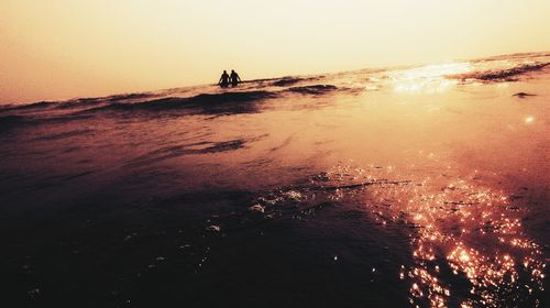 Scenic view of sea at sunset