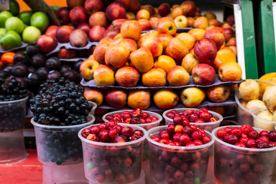 Varieties of fruits and vegetables stacked and ready for sale. organic concept.