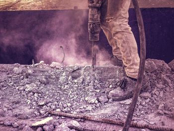 Low section of man working at construction site