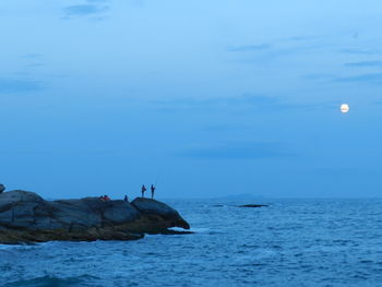 Scenic view of sea against sky at dusk