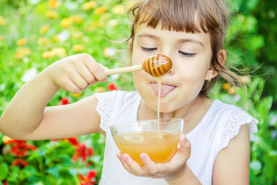 Portrait of cute girl eating food