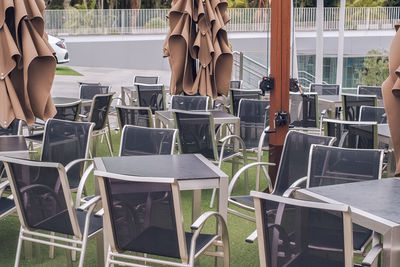 Empty chairs and tables at restaurant