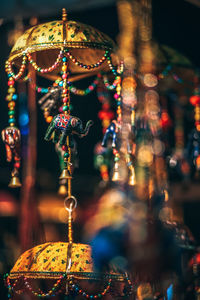 Close-up of decorations hanging for sale at market stall