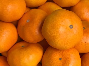 Full frame shot of oranges in market