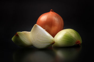 Close-up of fruits against black background