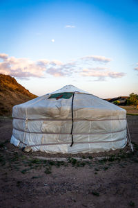 Tent on field against sky