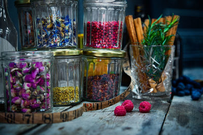 Close-up of fruits in glass jar on table