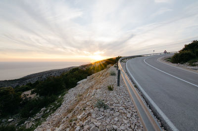 Road leading to the right at sunset