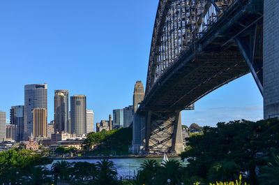 Low angle view of skyscrapers against blue sky