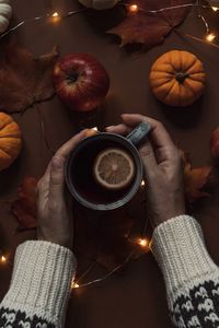 High angle view of hand holding drink