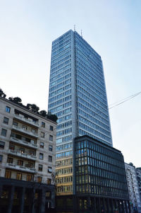 Low angle view of skyscrapers against clear sky