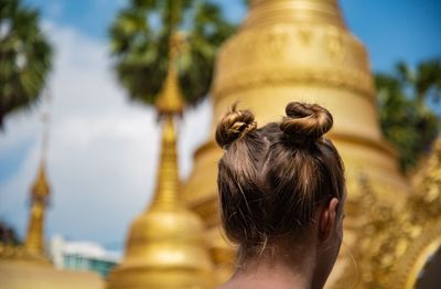 Rear view of woman outside temple