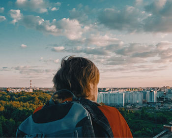 Rear view of woman against sky