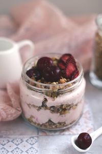 Close-up of dessert in glass jar on table