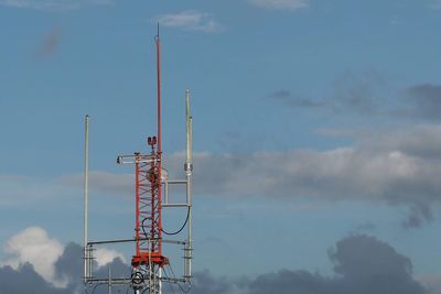 Low angle view of communications tower against sky