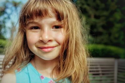 Close-up portrait of smiling girl