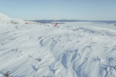 High angle view of snow covered land against sky