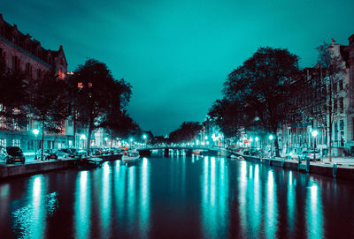 Illuminated buildings in city at night